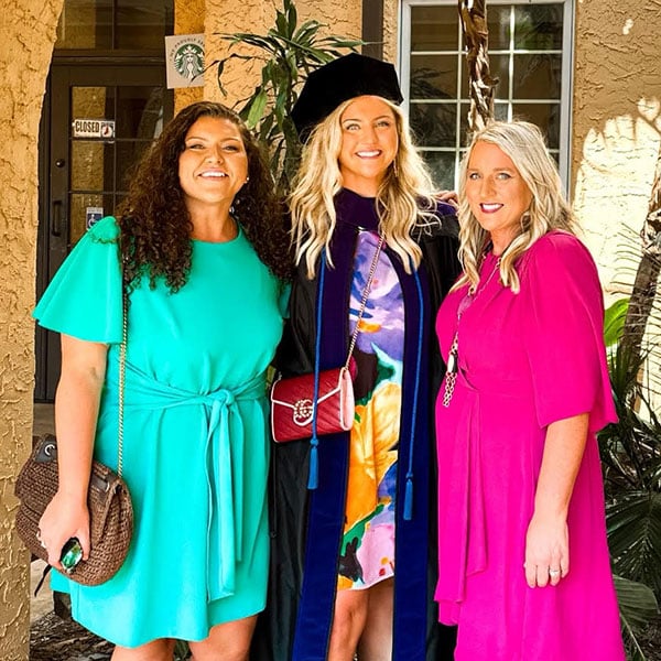 E. Lynn Gibbons and daughter Katelynn Gibbons with Delanie Gibbons at her graduation ceremony